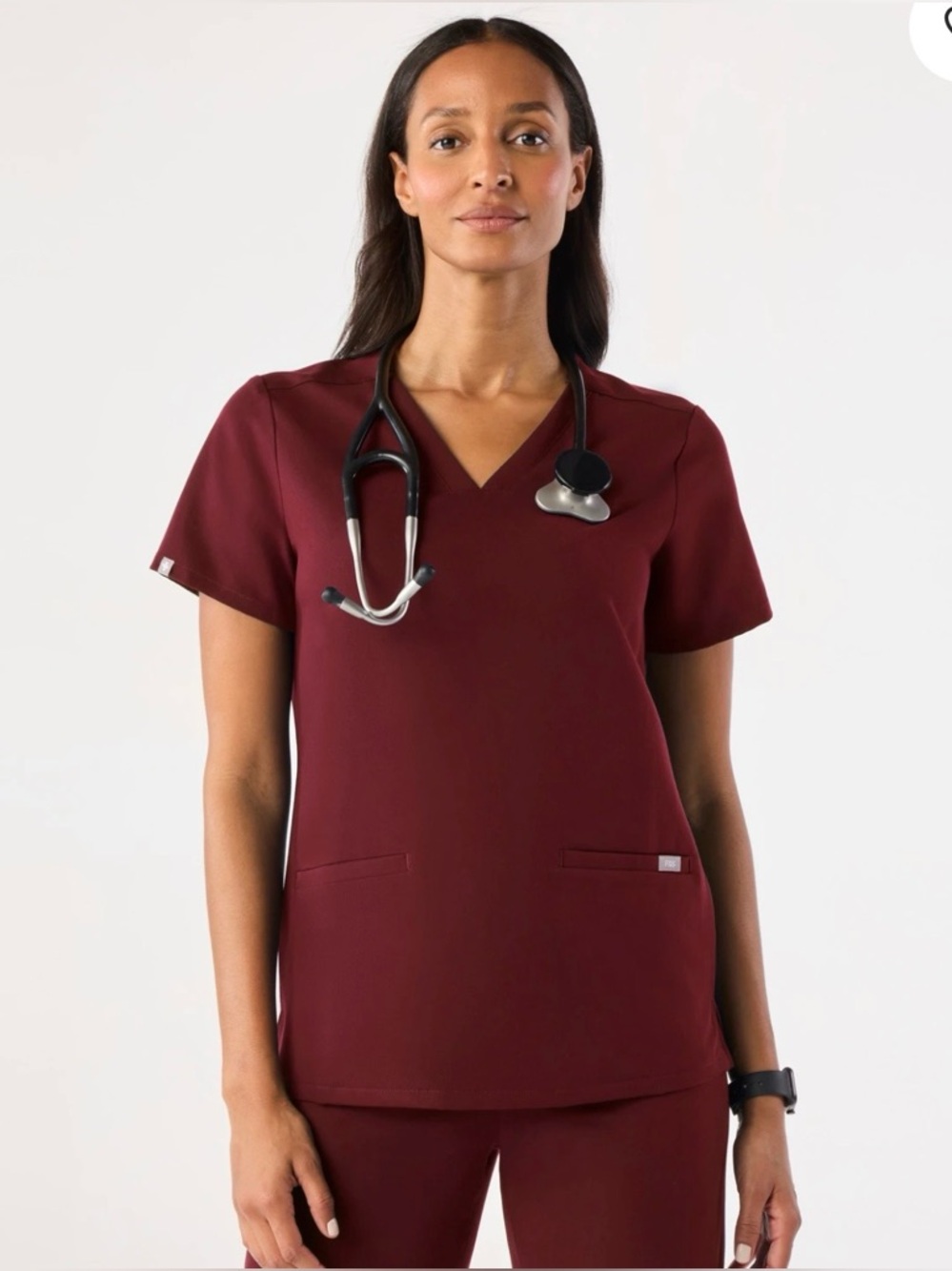 FIGS Casma Women's Scrub Top in burgundy.